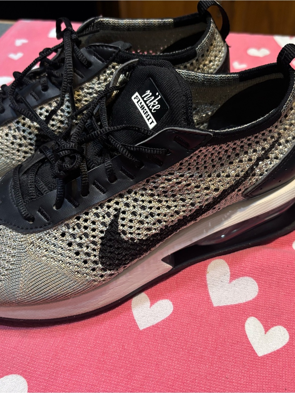 Nike Women's Black and Metallic Gold Flyknit Athletic Shoes